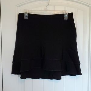 BCBG skirt. Thigh length, black, ruffled layers.